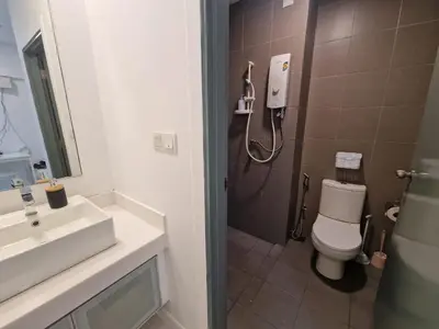 a bathroom with a shower and a toilet and a sink at Studio in Kuala Lumpur
