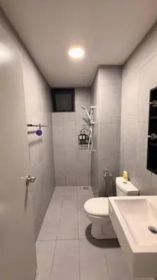 a white bathroom with a toilet and a sink at M Vertica KL Cheras Velocity KLCC View in Kuala Lumpur