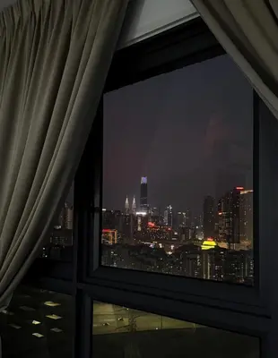 a view of a city skyline from a window at M Vertica KL Cheras Velocity KLCC View in Kuala Lumpur