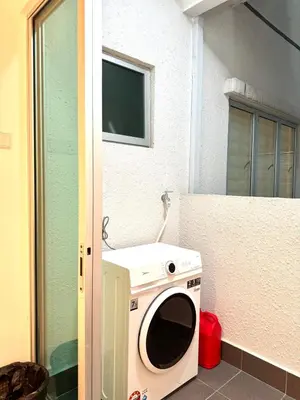 a washer and dryer sitting outside of a building at 2BR unit in Razak City Residence by Lisa Homestay in Kuala Lumpur