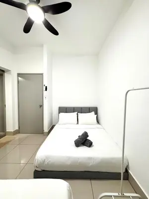 a bedroom with a bed with a ceiling fan at 2BR unit in Razak City Residence by Lisa Homestay in Kuala Lumpur