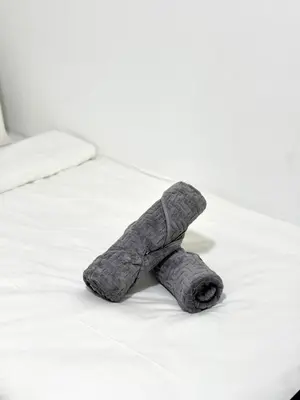 a teddy bear is laying on a bed at 2BR unit in Razak City Residence by Lisa Homestay in Kuala Lumpur