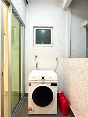 a washer and dryer sitting on the floor of a room at 2BR unit in Razak City Residence by Lisa Homestay in Kuala Lumpur