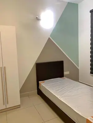 a small room with a bed with a ceiling at Flora Residency Setapak in Kuala Lumpur