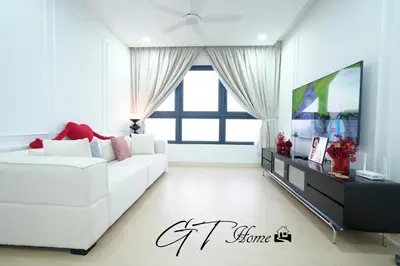 a living room with a white couch and a tv at Gt home-Kuala Lumpur View 3Bedroom 2Bathroom in Kuala Lumpur