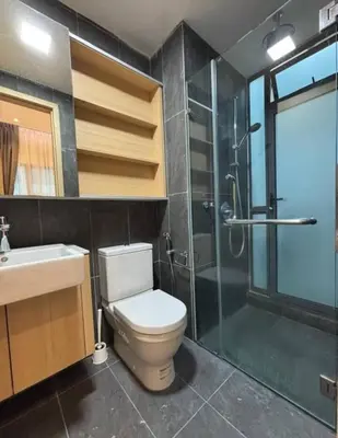 a bathroom with a toilet and a shower and a sink at The Colony By Infinitum L in Kuala Lumpur