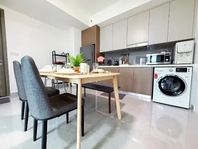 a kitchen with a table and chairs in a kitchen at Agile Delima Bukit Bintang in Kuala Lumpur