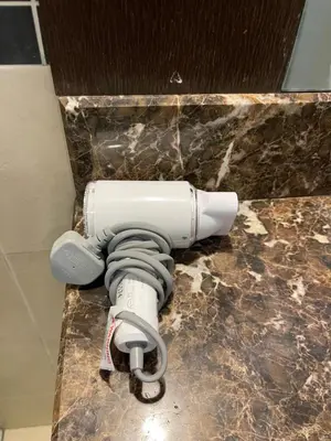 a camera on a counter in a bathroom at Kuala lampur city centre in Kuala Lumpur