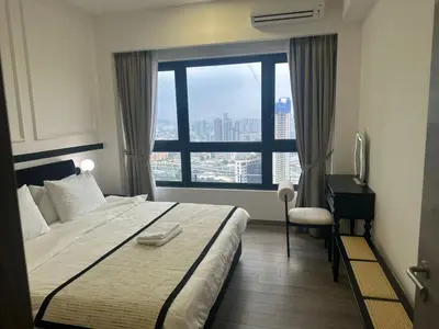 a hotel room with a bed and a window at Agile Residence Near TRX in Kuala Lumpur