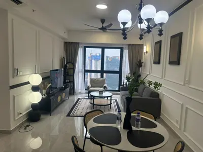 a living room with a table and chairs at Agile Residence Near TRX in Kuala Lumpur