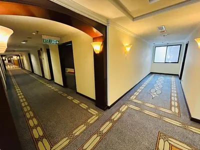 a hallway of a building with a hallwayngth at Holiday Residence at times square kL in Kuala Lumpur