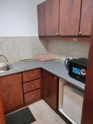 a small kitchen with a sink and a microwave at Homestay suite at times square KL in Kuala Lumpur