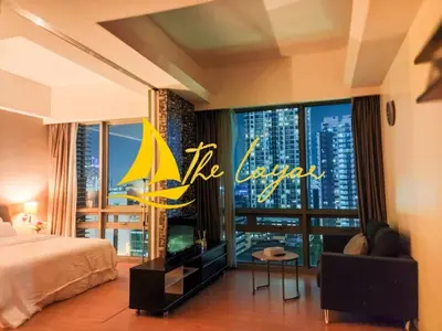 a hotel room with a bed and a large window at Central 1BR Merdeka 118 View in Kuala Lumpur