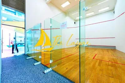 a glass wall in an office with a basketball court at Central 1BR Merdeka 118 View in Kuala Lumpur