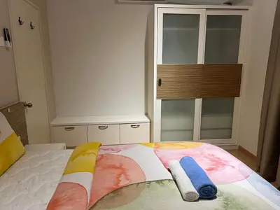 a bedroom with a bed with two towels on it at Seri bukit ceylon kl in Kuala Lumpur