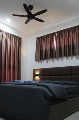 a bedroom with a bed with a ceiling fan at COZY Kenwingston platz KL 2-5PAX Klcc View Pakin Nefix Free parkin 1807 in Kuala Lumpur