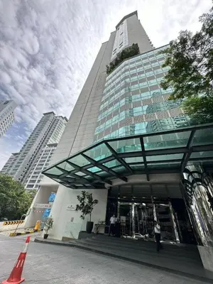 a tall building with a glass canopy in front of it at Flexy Suite at One Bukit Ceylon Bukit Bintang in Kuala Lumpur
