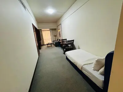 a hotel room with a bed and a desk at My Residence suite at Berjaya times square Kl in Kuala Lumpur