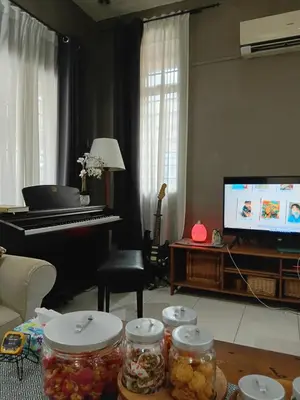 a living room with a piano and jars of food at Politeknik metro kl in Kuala Lumpur