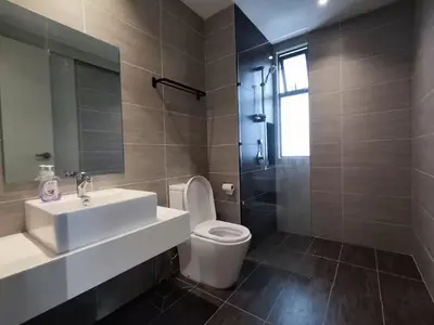 a bathroom with a sink and a toilet and a shower at Trion KL at Level 57 in Kuala Lumpur