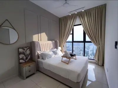 a bedroom with a white bed and a window at Trion KL at Level 57 in Kuala Lumpur