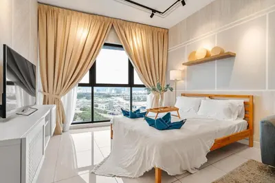 a bedroom with a bed and a large window at Muji Studio Continew by RumaBnB in Kuala Lumpur