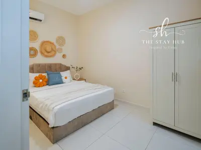 a bedroom with a bed and a sign that reads the stay hub at Majestic Residence - Central KL Stay with Petronas Twin Towers View Sky Pool by The Stay Hub in Kuala Lumpur