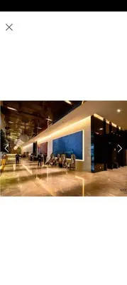 a group of people sitting on a bench in a building at The Platinum At Klcc Of SmartWill Holding in Kuala Lumpur