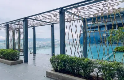 a building with a view of the water at Manor Residence KLCC - LV Home in Kuala Lumpur