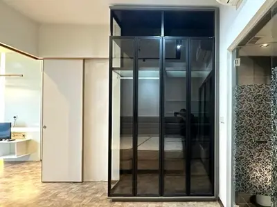 a large glass cabinet in a room at KLCC Expressionz Couple Suites 1B1B in Kuala Lumpur