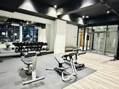 a gym with several treadmills and exercise bikes at SS Luxury Suites AT TM Persiaran Stonor KLCC in Kuala Lumpur