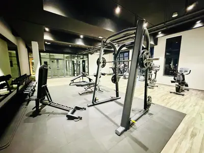 a gym with a bunch of equipment in a room at SS Luxury Suites AT TM Persiaran Stonor KLCC in Kuala Lumpur