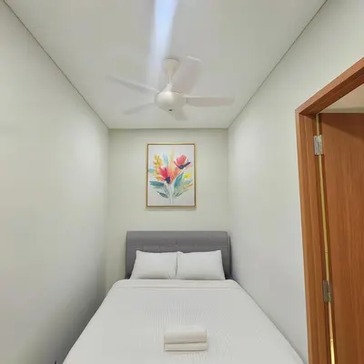 a bed in a room with a ceiling at Sky Suites KLCC - Luxury Service Apartments Near Petronas Twin Tower in Kuala Lumpur