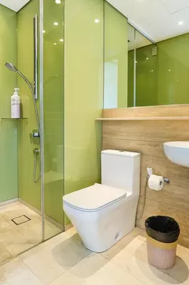 a bathroom with a toilet and a shower and a sink at Sky Suites KLCC - Luxury Service Apartments Near Petronas Twin Tower in Kuala Lumpur