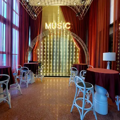 a room with tables and chairs and a mitzvah sign at Scarletz Villa Near By KLCC in Kuala Lumpur