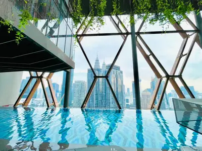 a swimming pool on the top of a skyscraper at Scarletz Villa Near By KLCC in Kuala Lumpur