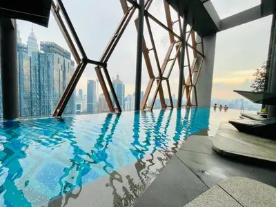 a swimming pool with a view of a city at Scarletz Villa Near By KLCC in Kuala Lumpur