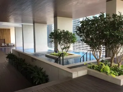 a lobby with trees and a pool in a building at Mindful Bangsar Loft KL Sentral Mid Valley The Gardens Pasar Seni in Kuala Lumpur