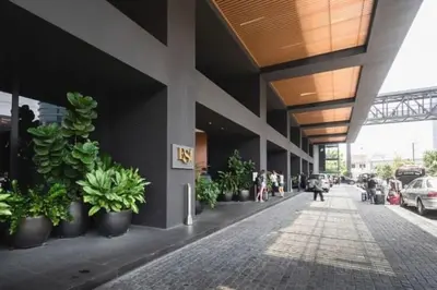 a building with potted plants on the side of it at Mindful Bangsar Loft KL Sentral Mid Valley The Gardens Pasar Seni in Kuala Lumpur