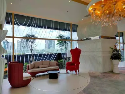 a living room with a couch and chairs and a chandelier at ARTE Mont Kiara Designer Suites by HOST CORNER in Kuala Lumpur