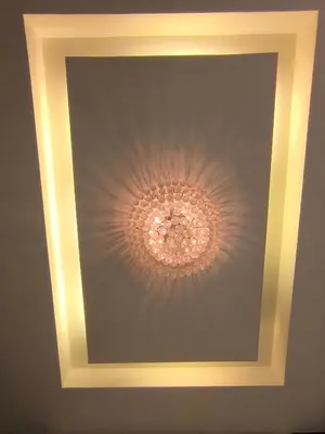 a coffered ceiling with a chandelier in the ceiling at Dorsett Luxury Residence KL in Kuala Lumpur
