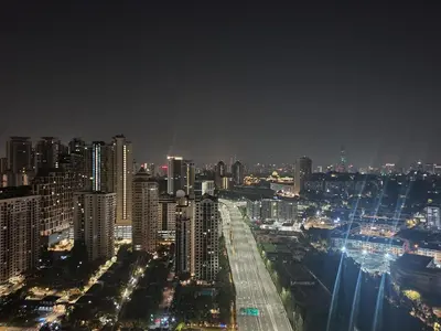 a view of a city at night with lights at Kiaramas Gateway Residence in Kuala Lumpur