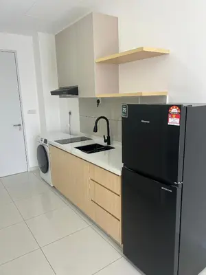 a kitchen with a black refrigerator and a dishwasher at MAJESTIC RESlDENCE KLCC in Kuala Lumpur
