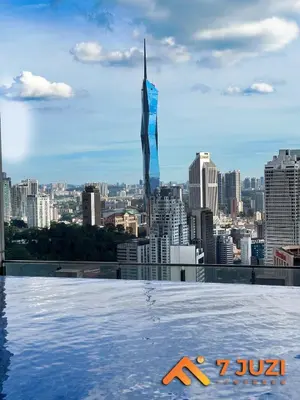 a view of the city from the rooftop of a building at KLCC Cozy Suite 21F with Best View Infinity Pool in Kuala Lumpur