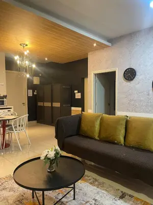 a living room with a couch and a table at Arte Ampang KLCC 2 BR Homestay, 4-6 pax in Ampang