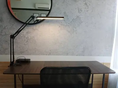 a desk with a lamp and a mirror on a wall at Arte Ampang KLCC 2 BR Homestay, 4-6 pax in Ampang