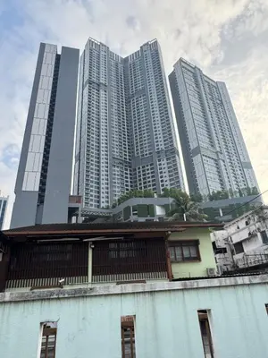 a building with tall buildings in the background at Deluxe Duplex Studio Suite at Agile Bukit Bintang in Kuala Lumpur