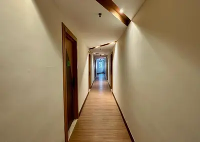 a hallway with a long corridor with a long hallway at Swing & Pillows - Chow Kit Road, Kuala Lumpur in Kuala Lumpur