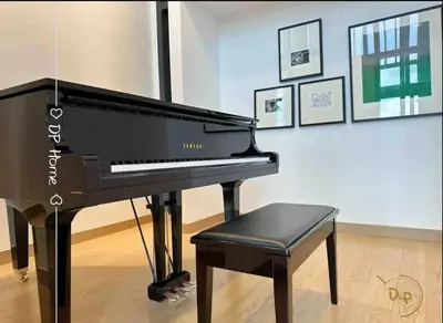 a black piano and a stool in a room at Stay At KL 4 pax at Bukit Bintang KL Monorail in Kuala Lumpur