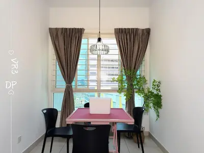 a dining room with a table with a laptop on it at VR3 2R2B 6pax Sunway Velocity LINK Mall MRT in Kuala Lumpur